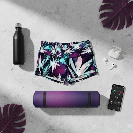 Floral shorts with a black water bottle, purple yoga mat, white earbuds, and smartphone on a gray surface.