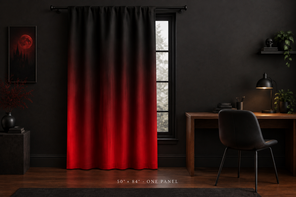 A single panel curtain hanging in a dark room, featuring a black-to-red gradient design. The room is styled with a wooden desk, black chair, lamp, and wall art.