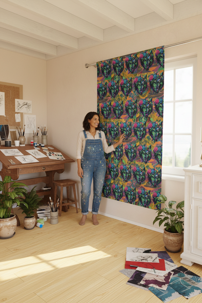 Woman standing in a room with colorful patterned curtains and a desk.