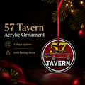 A circular acrylic Christmas ornament featuring a red car and the text '57 TAVERN' in white and yellow, hanging from a red ribbon against a dark holiday background with pine branches and warm lights.