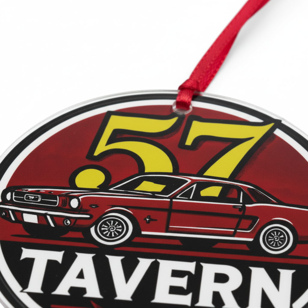 A close-up of a round hanging ornament featuring a red classic car, a large yellow '57' graphic, and the word 'TAVERN' on a white background, with a red ribbon loop at the top.