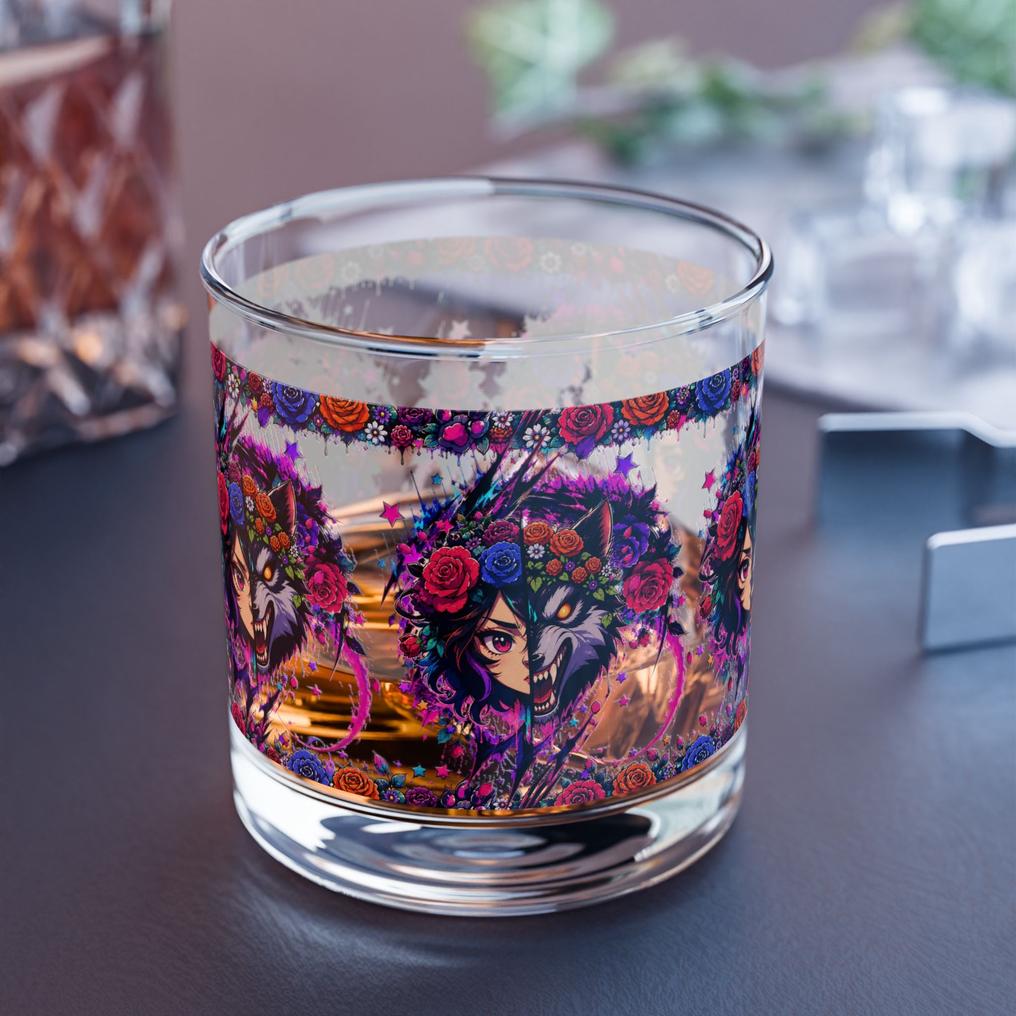 Candle with colorful design on a dark surface