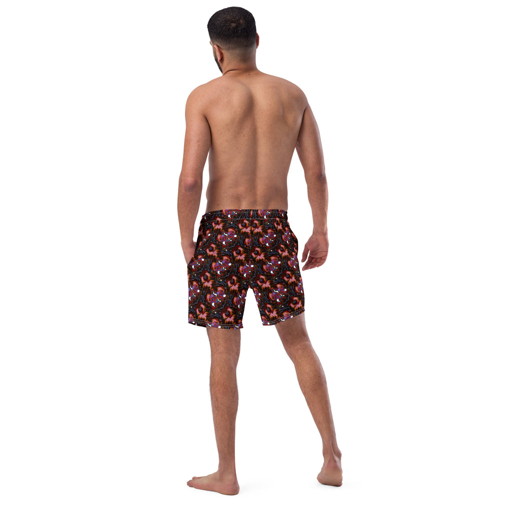 Man wearing maroon swim shorts on a white background