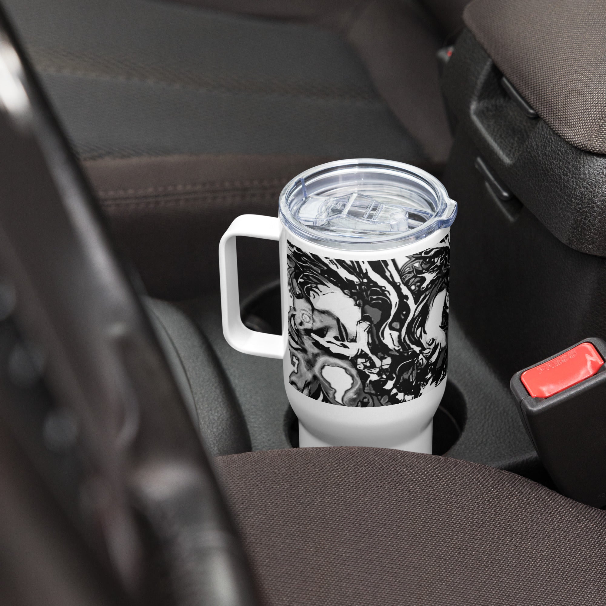 Marbled patterned tumbler in a car cup holder