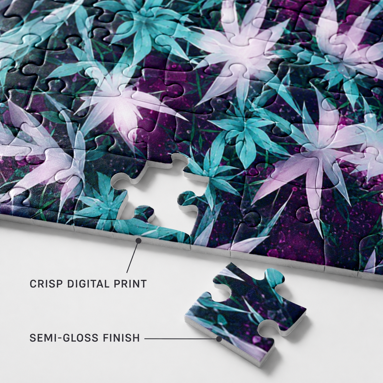 A completed jigsaw puzzle with a purple and teal floral pattern, shown on a white surface with one loose puzzle piece below. Text on the image reads 'CRISP DIGITAL PRINT' and 'SEMI-GLOSS FINISH'.