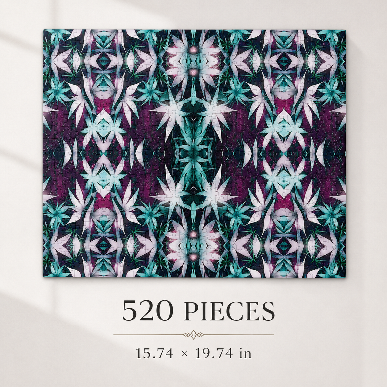 A completed jigsaw puzzle featuring a symmetrical, kaleidoscopic floral pattern in teal, white, and deep purple, displayed on a light beige wall above text that reads '520 PIECES' and '15.74 x 19.
