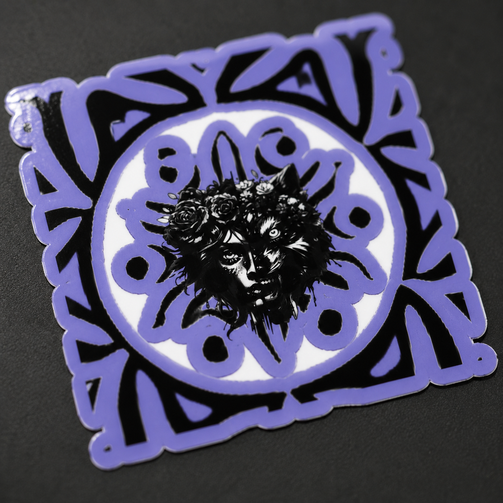 A square decorative sticker or patch with a purple border and a black-and-white central illustration of a face surrounded by flowers, shown on a dark background.