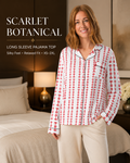 A woman stands in a bedroom wearing a long-sleeve pajama top with a white base and red botanical-style vertical pattern, paired with light beige pants. Text on the left reads 'SCARLET BOTANICAL' and 'LONG SLEEVE PAJAMA TOP' with additional fit details.