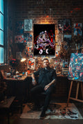 An abstract canvas print featuring a symmetrical skull design, displayed above a wooden console table with a black teapot and books on top.